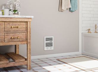 A bathroom with a Com-Pak series heater built into the wall