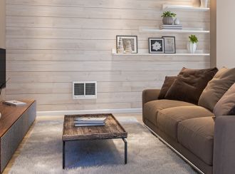 A living space with a Com-Pak Series twin heater built into the wall