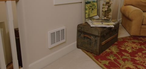A living space with a Com-Pak Series Max heater built into the wall
