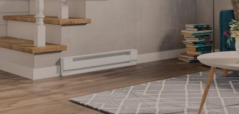 A living space with a Cadet Baseboard heater mounted onto the wall