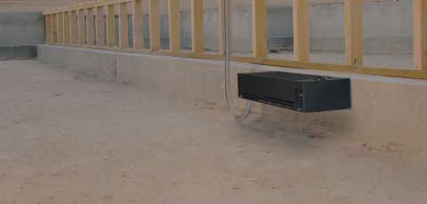 A Frost Protection Heater mounted to an outside wall