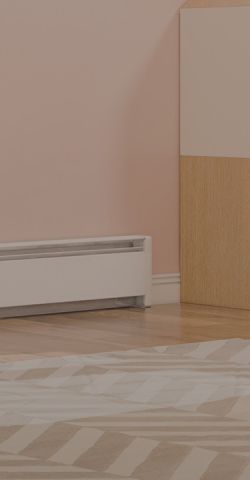 A child's bedroom with a Cadet Baseboard heater mounted to the wall 