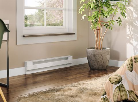 A living space with a Cadet Baseboard heater mounted onto the wall