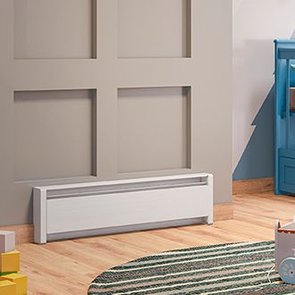 A living space with a Cadet Softheat Baseboard heater mounted onto the wall